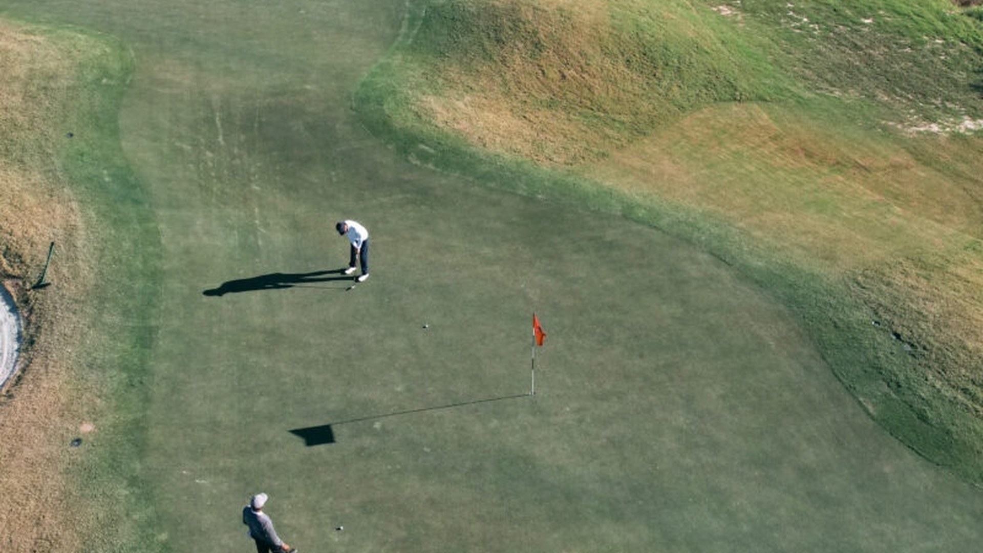 Aerial view of golfers playing a hole at East River 9 in Houston.