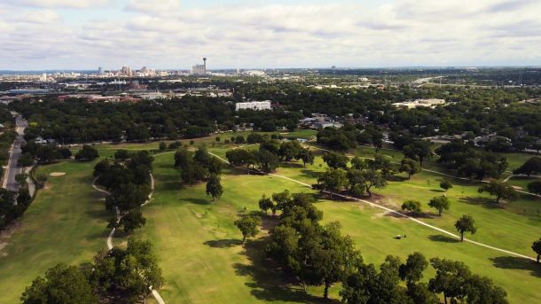 Aerial view of Riverside Golf Course with tree-lined fairways in San Antonio.