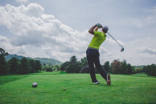 Golfer celebrating a tournament win on the course
